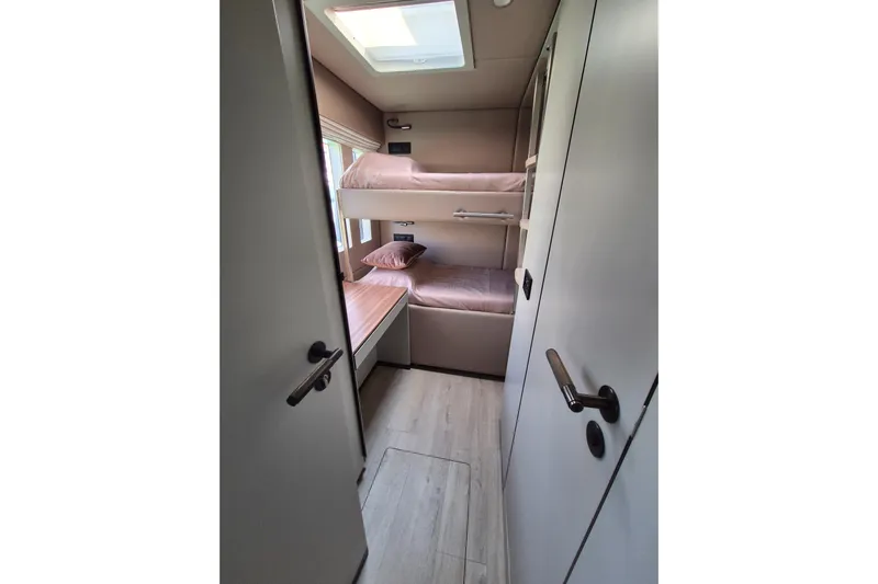 Alemys Yacht Photos Pics Interior of 2023 Sunreef 50 yacht with cozy bunk beds and modern design.