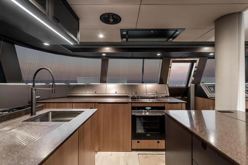 Alemys Yacht Photos Pics Luxurious Sunreef 50 yacht kitchen interior, featuring modern design and high-end appliances, 2023 model.