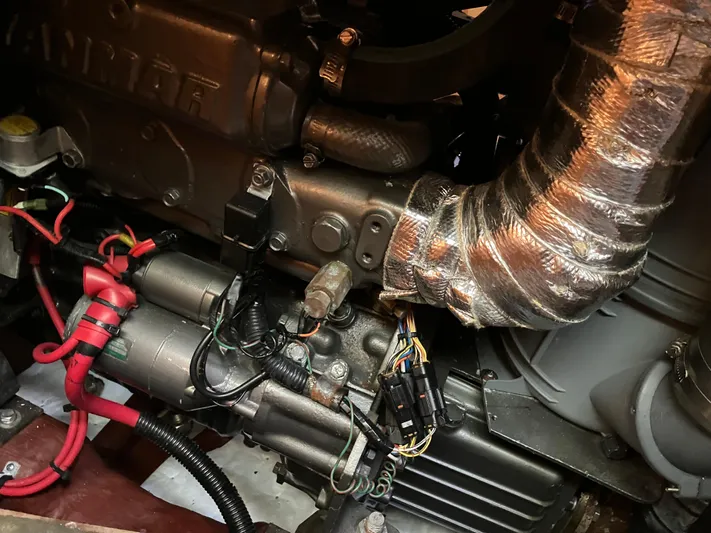 Escapade Yacht Photos Pics Engine components of a 1997 Sabre 402, featuring wiring and metallic tubing.