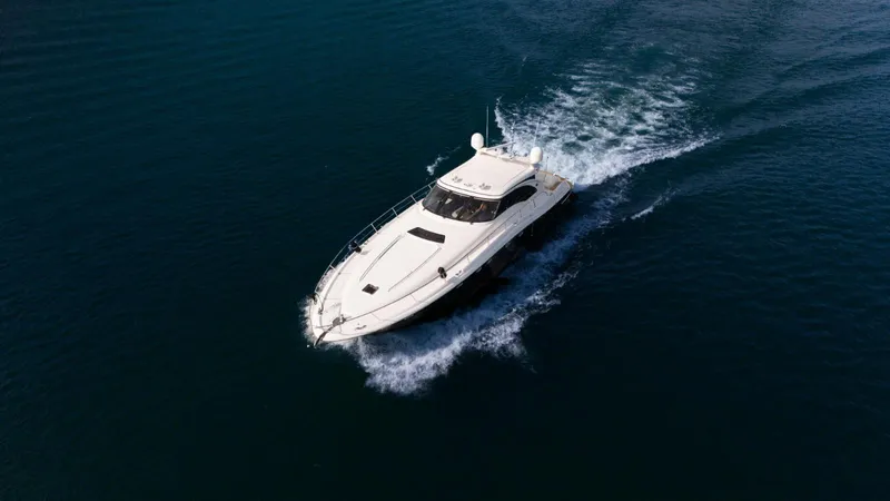  Yacht Photos Pics 2003 Sea Ray 680 Sun Sport yacht cruising on open water.