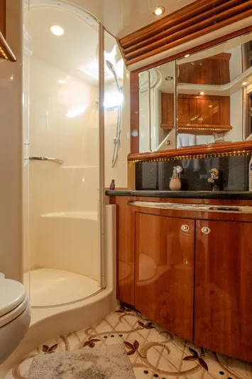  Yacht Photos Pics Luxurious bathroom in 2003 Sea Ray 680 Sun Sport yacht with elegant wood cabinetry and modern shower.