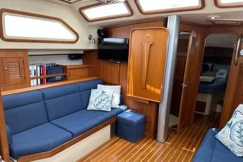 Sapphire Seas Yacht Photos Pics Interior of a 2005 Island Packet 445 yacht with blue upholstery.