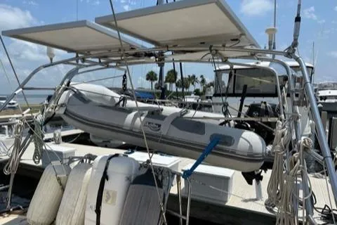 Sapphire Seas Yacht Photos Pics 2005 Island Packet 445 sailboat with dinghy and solar panels.