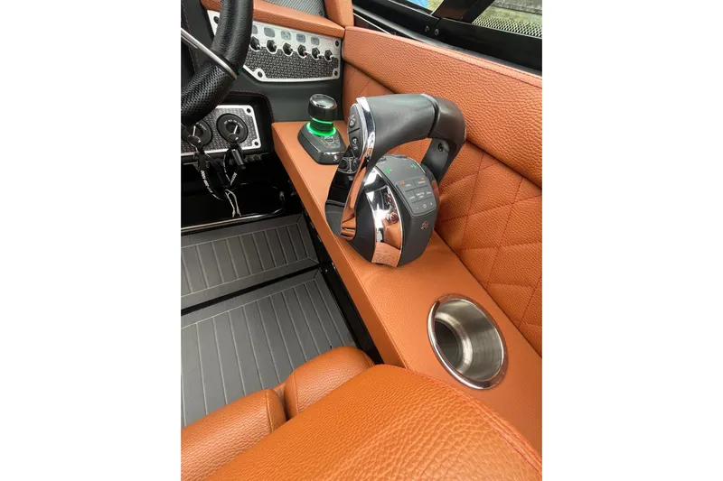  Yacht Photos Pics 2022 Cruisers Yachts 338 South Beach Edition Bow Rider cockpit with luxurious leather and controls.