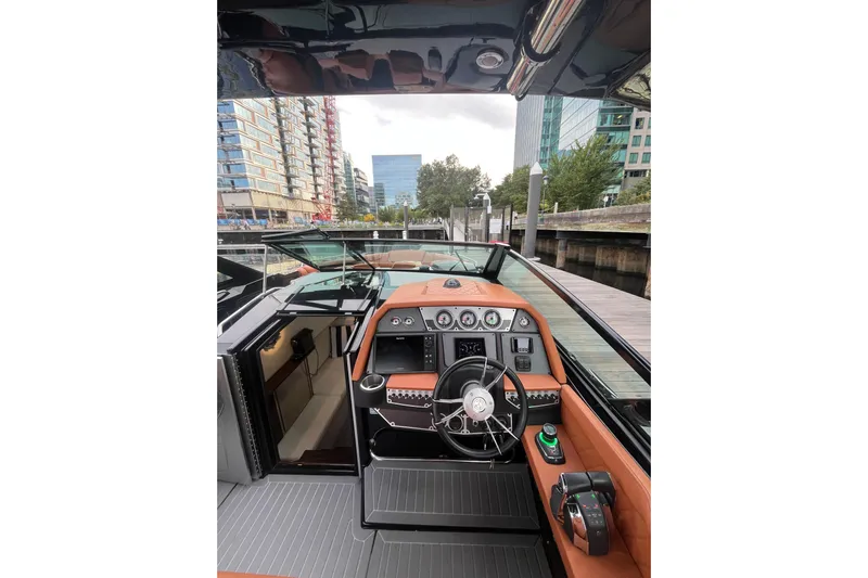  Yacht Photos Pics 2022 Cruisers Yachts 338 South Beach Edition Bow Rider interior with modern dashboard and steering.