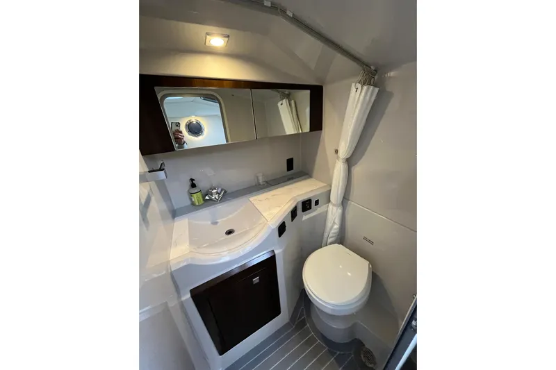  Yacht Photos Pics 2022 Cruisers Yachts 338 South Beach Edition Bow Rider bathroom interior with modern fixtures.