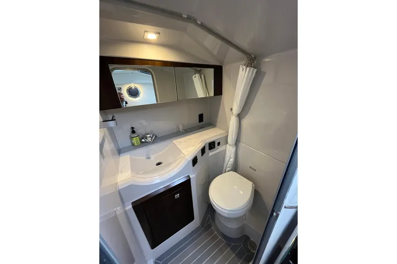  Yacht Photos Pics 2022 Cruisers Yachts 338 South Beach Edition Bow Rider bathroom interior with modern fixtures.