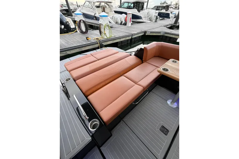  Yacht Photos Pics 2022 Cruisers Yachts 338 South Beach Edition Bow Rider with luxurious seating at dock.