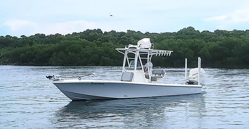  Yacht Photos Pics 2017 SeaVee 270Z boat on calm water with lush green background.
