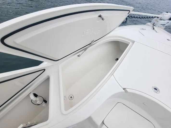  Yacht Photos Pics 2017 SeaVee 270Z boat with open storage compartment on deck.