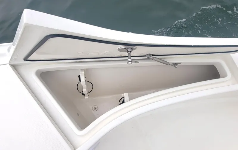  Yacht Photos Pics Open storage compartment on 2017 SeaVee 270Z boat, showing interior details.