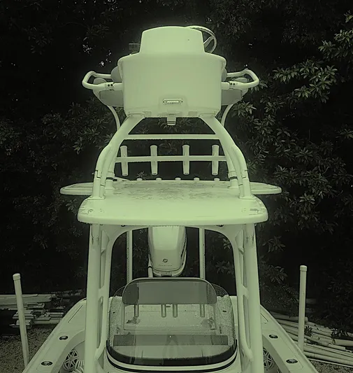  Yacht Photos Pics 2017 SeaVee 270Z boat with elevated helm station, surrounded by lush greenery.