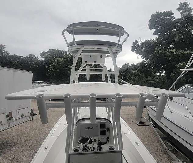  Yacht Photos Pics 2017 SeaVee 270Z boat with fishing rod holders and navigation equipment, docked outdoors.