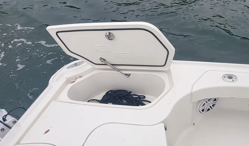  Yacht Photos Pics 2017 SeaVee 270Z boat storage compartment with open lid, revealing coiled rope inside.