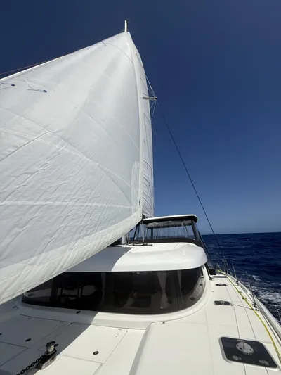 No Schedule Yacht Photos Pics 2019 Lagoon 42 Owners Version sailing on open sea under clear blue sky.