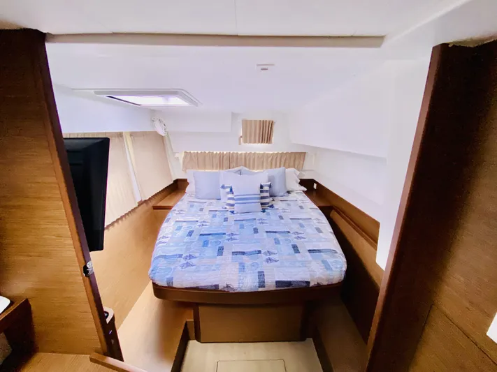 No Schedule Yacht Photos Pics 2019 Lagoon 42 Owners Version cabin with cozy bed and modern interior design.