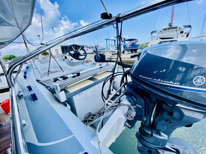 No Schedule Yacht Photos Pics 2019 Lagoon 42 Owners Version yacht with Yamaha outboard motor, docked in a marina.