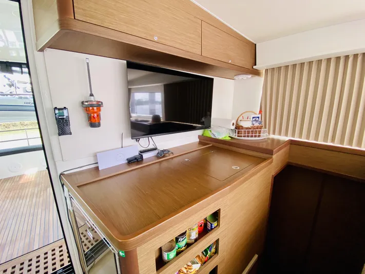No Schedule Yacht Photos Pics Interior of 2019 Lagoon 42 Owners Version yacht with modern kitchen and storage.