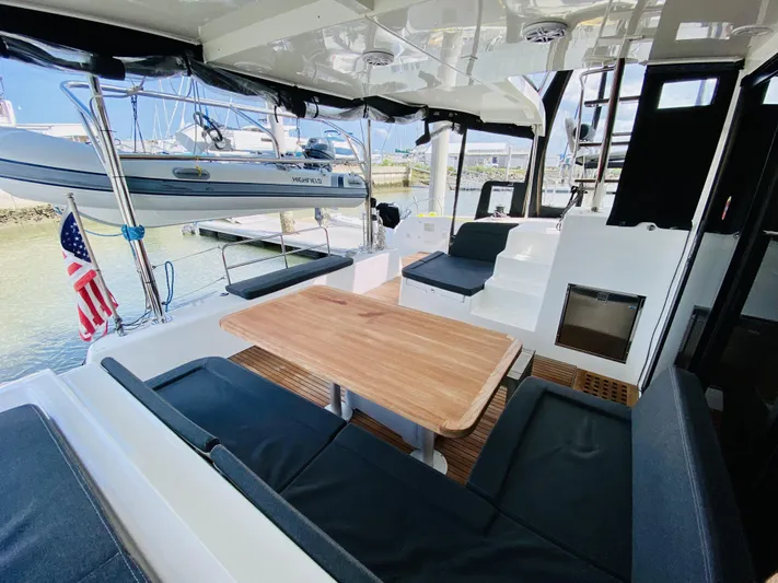 No Schedule Yacht Photos Pics 2019 Lagoon 42 Owners Version yacht with spacious outdoor seating and dining area.