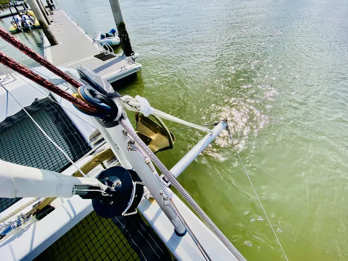 No Schedule Yacht Photos Pics 2019 Lagoon 42 Owners Version catamaran docked, showing deck and water reflections.