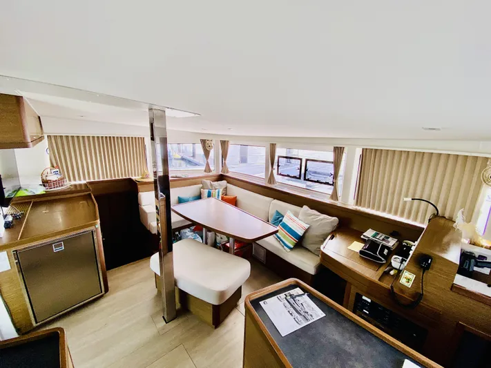 No Schedule Yacht Photos Pics Spacious interior of 2019 Lagoon 42 Owners Version catamaran with modern furnishings and ample seating.