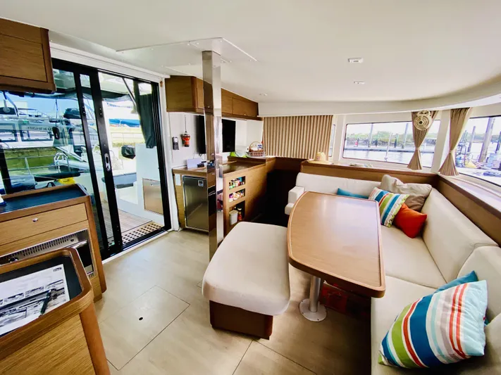 No Schedule Yacht Photos Pics Interior of 2019 Lagoon 42 Owners Version catamaran with modern seating and vibrant cushions.