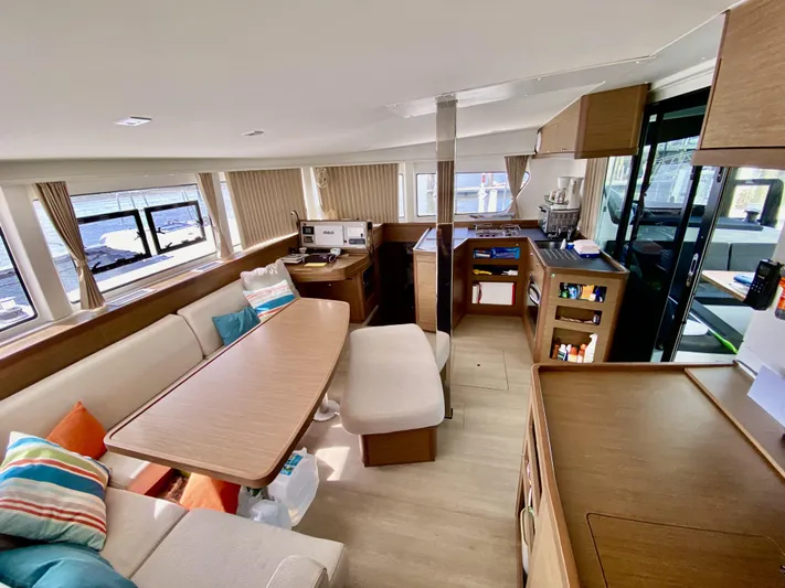 No Schedule Yacht Photos Pics Luxurious interior of 2019 Lagoon 42 Owners Version catamaran with modern furnishings and ample natural light.