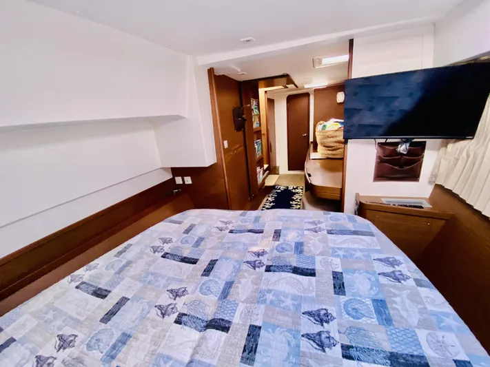 No Schedule Yacht Photos Pics 2019 Lagoon 42 Owners Version cabin with bed, TV, and modern interior design.