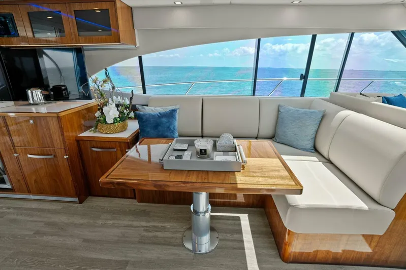 Gia Yacht Photos Pics Luxurious interior of 2021 Riviera 5400 Sport Yacht with ocean view.