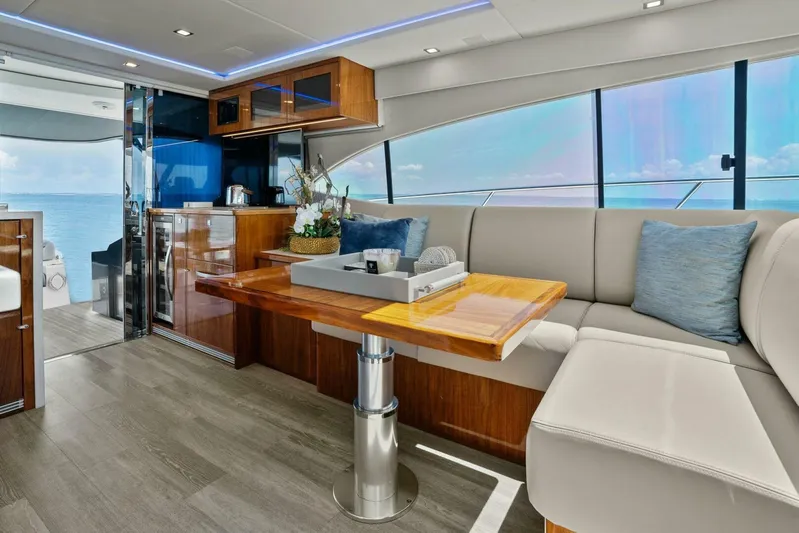 Gia Yacht Photos Pics 2021 Riviera 5400 Sport Yacht interior with elegant seating and ocean view.