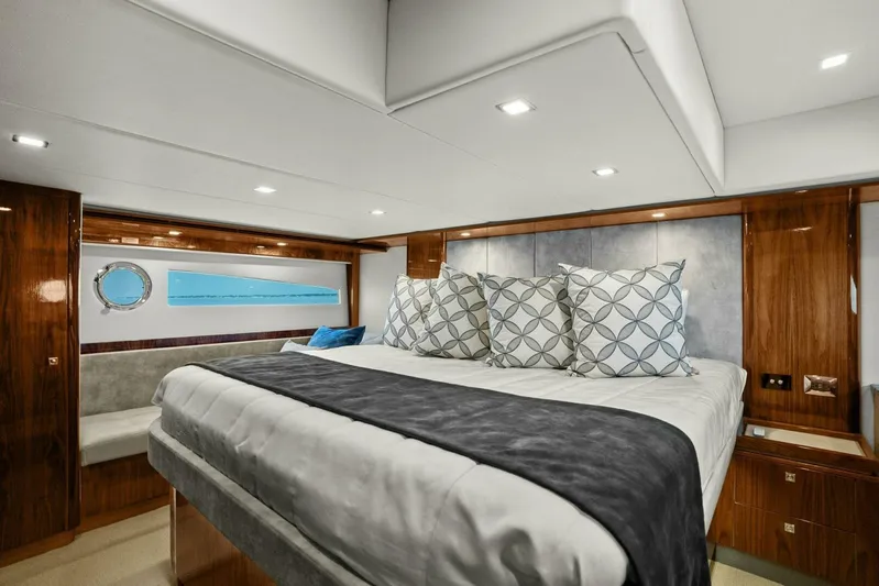 Gia Yacht Photos Pics Luxurious bedroom interior of 2021 Riviera 5400 Sport Yacht with modern decor.