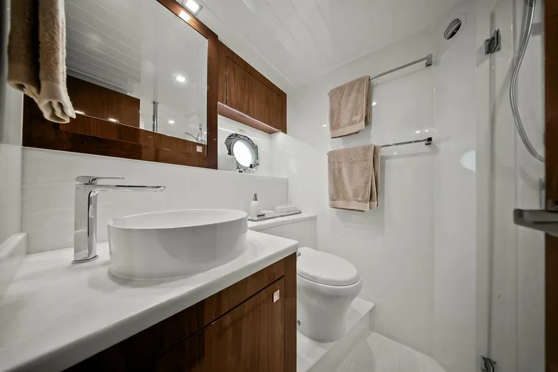 Gia Yacht Photos Pics Luxurious bathroom in 2021 Riviera 5400 Sport Yacht with modern fixtures and elegant design.