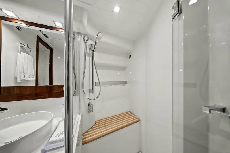 Gia Yacht Photos Pics Luxurious bathroom in 2021 Riviera 5400 Sport Yacht with modern fixtures and elegant design.