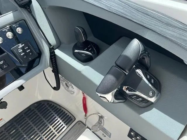  Yacht Photos Pics Control panel of 2022 Cobalt 30SC boat with throttle and joystick.