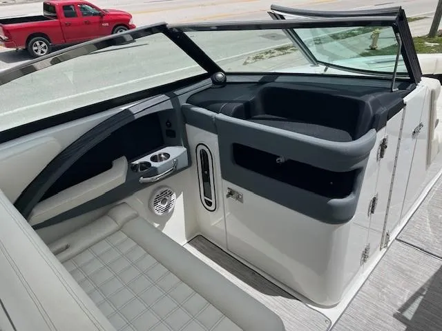  Yacht Photos Pics 2022 Cobalt 30SC boat interior with seating and dashboard, featuring modern design elements.