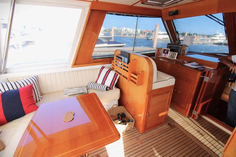 Sweet Yacht Photos Pics Interior of 2001 Grand Banks 49 Eastbay HX yacht with wood finish and nautical decor.