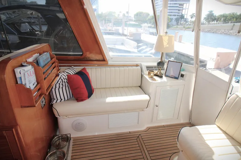 Sweet Yacht Photos Pics Luxurious interior of 2001 Grand Banks 49 Eastbay HX yacht with elegant seating and decor.