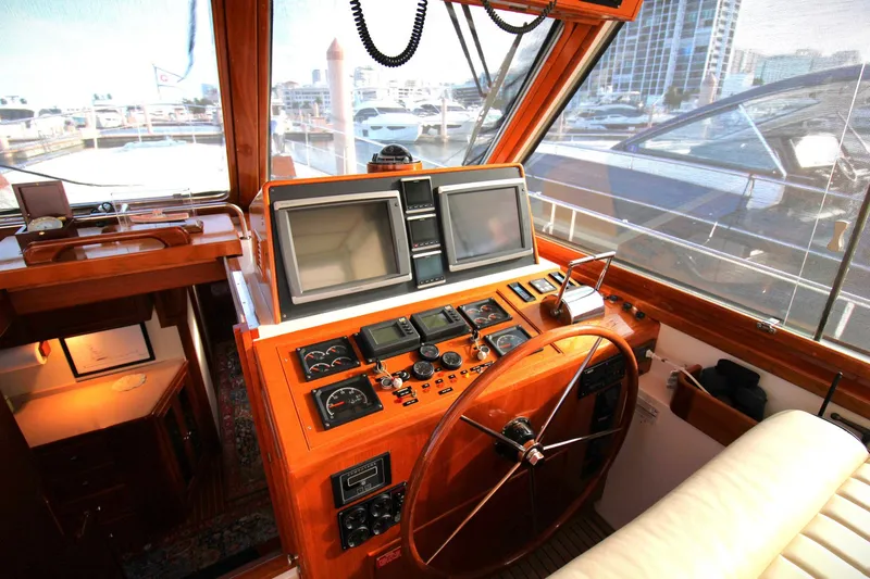 Sweet Yacht Photos Pics Helm of 2001 Grand Banks 49 Eastbay HX yacht with navigation equipment.