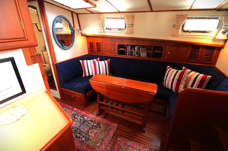 Sweet Yacht Photos Pics Luxurious 2001 Grand Banks 49 Eastbay HX yacht interior with elegant seating and wooden accents.