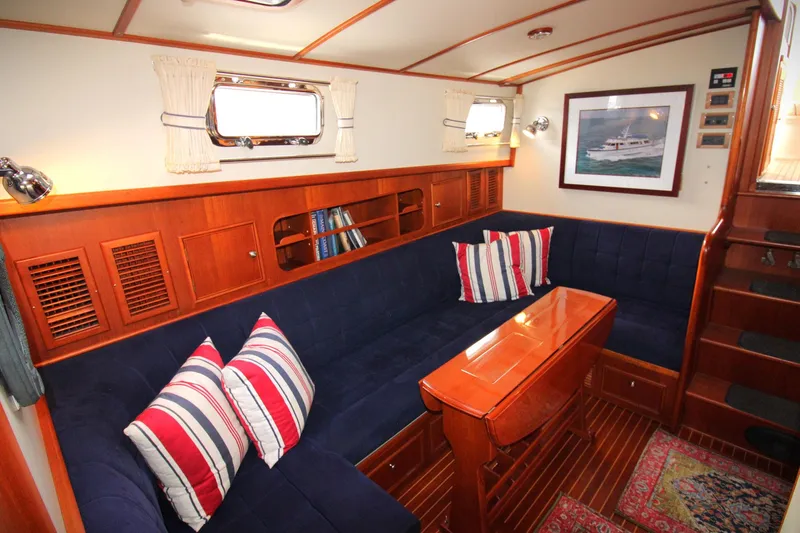 Sweet Yacht Photos Pics Interior of 2001 Grand Banks 49 Eastbay HX with cozy seating and nautical decor.