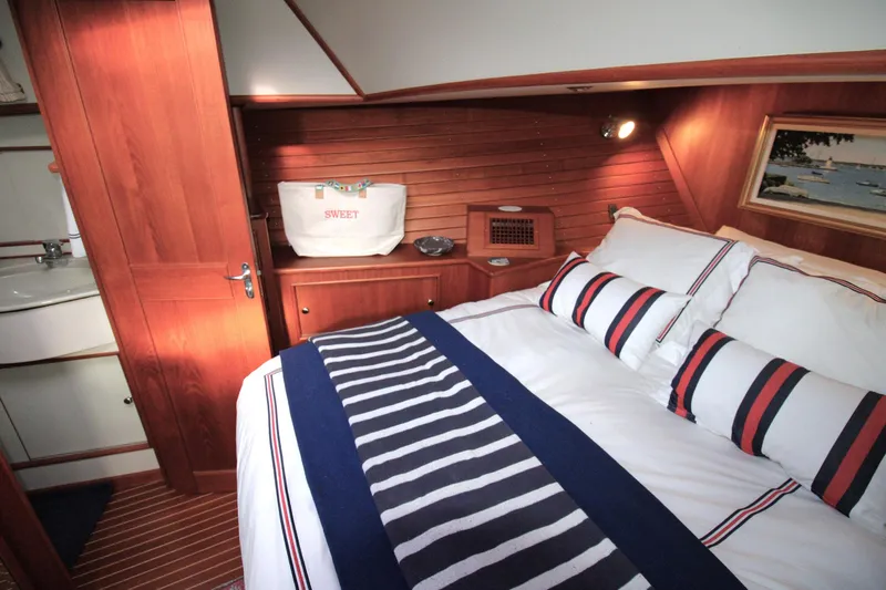Sweet Yacht Photos Pics Luxurious cabin interior of 2001 Grand Banks 49 Eastbay HX yacht with cozy bedding.
