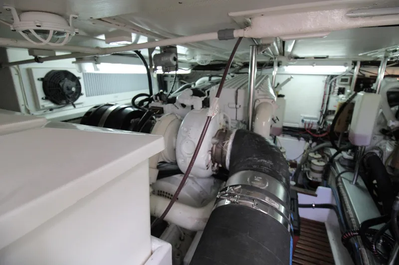 Sweet Yacht Photos Pics Engine room of 2001 Grand Banks 49 Eastbay HX yacht, showcasing mechanical components.