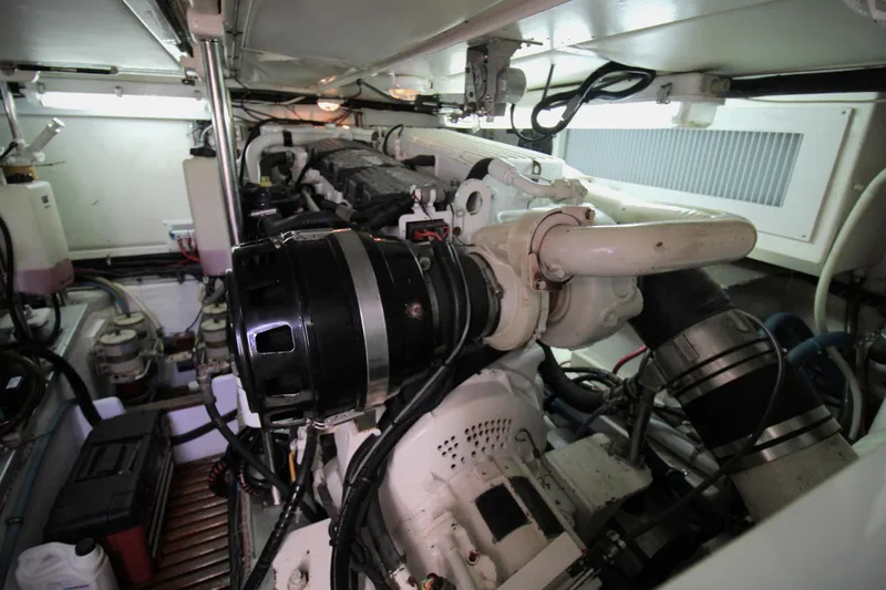 Sweet Yacht Photos Pics Engine room of 2001 Grand Banks 49 Eastbay HX yacht, showcasing mechanical components.