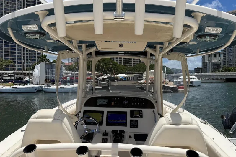  Yacht Photos Pics 2020 Grady-White Canyon 306 boat interior at marina, featuring helm and seating.