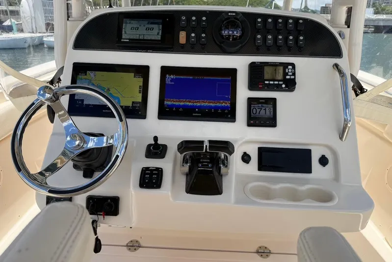  Yacht Photos Pics Control panel of 2020 Grady-White Canyon 306 boat with navigation and steering features.