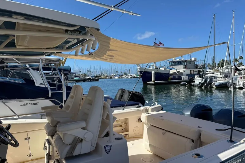  Yacht Photos Pics 2020 Grady-White Canyon 306 boat docked in a marina with sunshade.