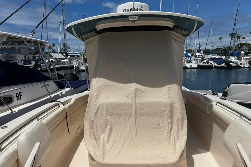  Yacht Photos Pics 2020 Grady-White Canyon 306 boat docked at marina, covered console, clear sky.