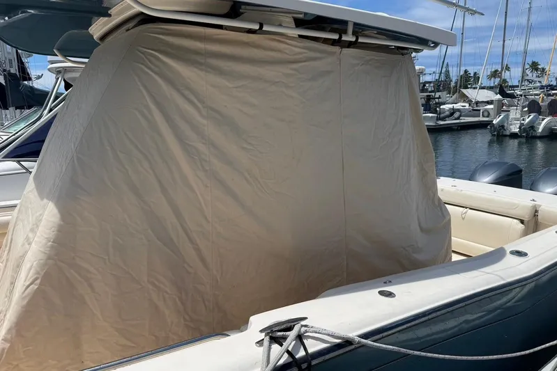  Yacht Photos Pics 2020 Grady-White Canyon 306 boat with protective cover at marina.