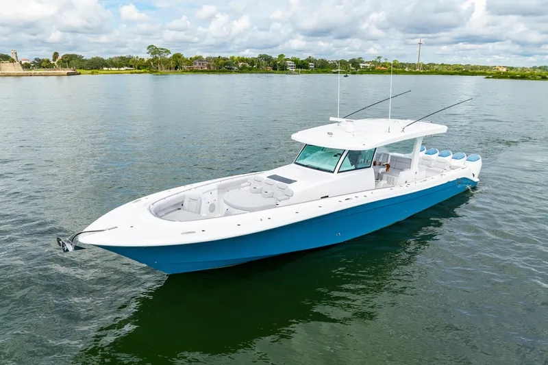  Yacht Photos Pics 2026 HCB 56 Suenos GIX luxury boat on calm water, featuring sleek design and spacious deck.