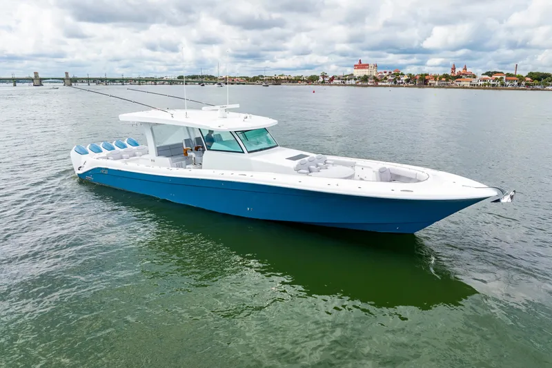  Yacht Photos Pics 2026 HCB 56 Suenos GIX luxury boat on calm water, blue and white design.